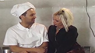 Two nasty chicks and kinky cook have dirty sex fun right on the kitchen table