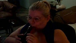 Extremely fat mature blonde lady sucks a dildo on the webcam