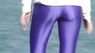 Candid amateur in lilac pantyhose walking along the quay 03zm