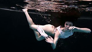 Skinny and petite bitch underwater exposes her body