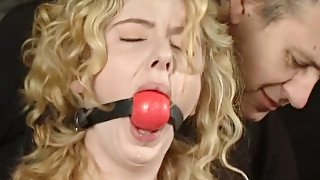 Beautiful curly blonde gets punished in the basement