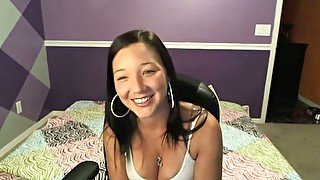 Giggling sexy and slender brunette cam hottie plays with her saggy tits