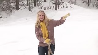 After playing in the snow he uses his cock to warm her up