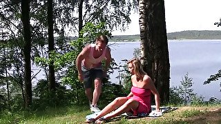 Ardent blond haired MILF lets dude finger her pussy near the river