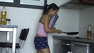 Nude couple having sex in the kitchen and reaching orgasm