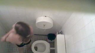 Spy video from a swimming pool toilet - babe takes a piss