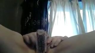 Chunky white redhead girl in her bedroom masturbating with a hairbrush