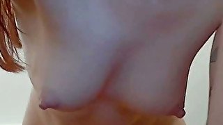 Lovely redhead webcam sexpot trains her asshole with anal plug