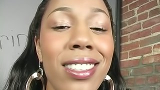 Stunning Black girl gives a blowjob in gloryhole show