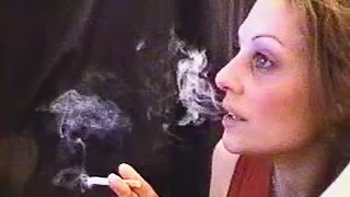 Webcam girl lights up a cigarette