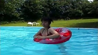 Japanese doll bathing in the outdoor pool wearing sexy tiny bikini