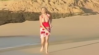 Curvy Alison Angel shows her boobs on a beach