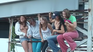 Randy teens on water ride enjoys stripping and displays ass and tits