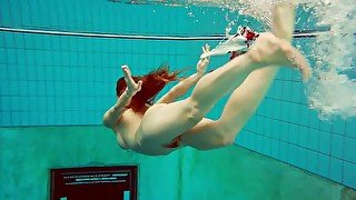 Kinky underwater stripping show performed by lovely amateur gal