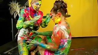 Girls make a mess painting each other and playing around