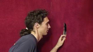 White guy sucks off a hard dick at the gloryhole