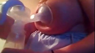 My cute wife was pumping up some milk from her big juggs