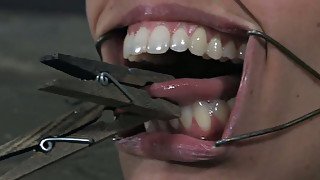 Skanky Latin doxy gets her nose holes and mouth widened with BDSM gadgets