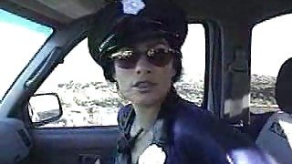 Torrid brunette cop girl gives me a handjob in my car