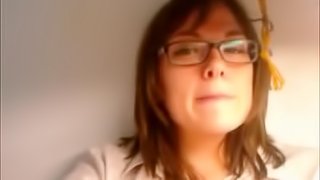 Cute brunette in glasses finger fucks her sweet pussy