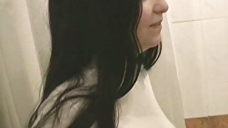 Brunette girl pisses in the shower