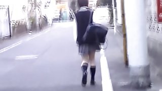 Cute Asian school-babe skirt sharked by a passerby.