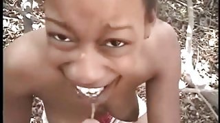 Black girl sucks a hard dick in the woods