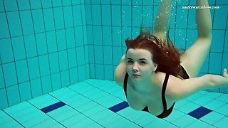 Beautiful Vesta stripping underwater in arousing solo video