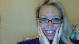 Sexy blonde nerd stripteasing and seducing on webcam at home