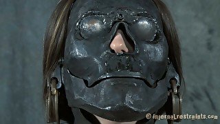 Young and sexy babe tries on a freaky mask