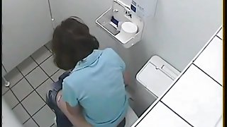 Girl pissing on toilet sitting on bowl back to the cam