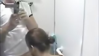 Hottie Sucks a Stranger's Cock in the Bathroom