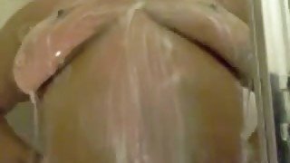 Chubby perverted black fatso takes a shower and masturbates on cam