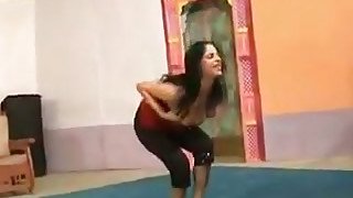 Raven haired Indian wife does her yoga exercises tight yoga pants