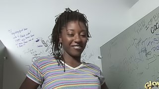 A slim Black girl sucks a white cock in a gloryhole