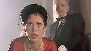 Woman in red dress gets butt slapped while some guys are watching.