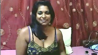 Sweet and busty mature Indian lady on webcam teasing