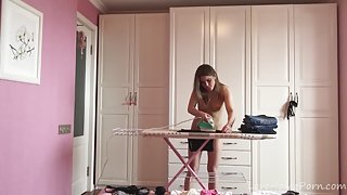 Ironing the kinky clothes while completely naked