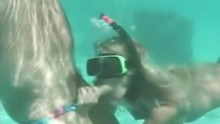 Horny couple having wild sex right in the ocean