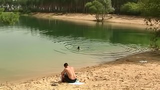 A couple goes for a swim then fucks in the sand on the beach