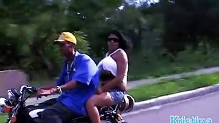 Huge boobs babe rides a motorcycle in public