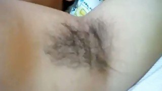 Dark haired hairy bitch shows closeup of armpits and bush