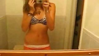 Slender pretty blonde girl flashed her small tits while stripping on webcam