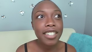 Shaved head black girl sucks to facial