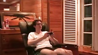 Nerdy guy plays videogames, while his hot gf rides his cock.