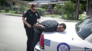 Horny officers of the law fuck black scofflaw in threesome