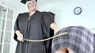 Mistress Granny Lacey canes her pupil before having fun with her
