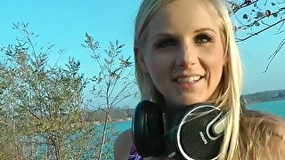 Cute blond babe is sucking dick in the open air
