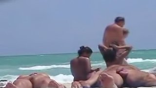 Voyeur's cam catches an Asian pussy on a nude beach