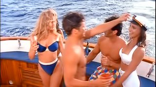 Three pmates, frolic nude on a yacht.